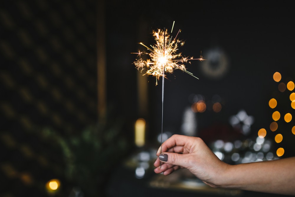 kaboompics.com_Woman-Holding-a-Christmas-Sparkler-